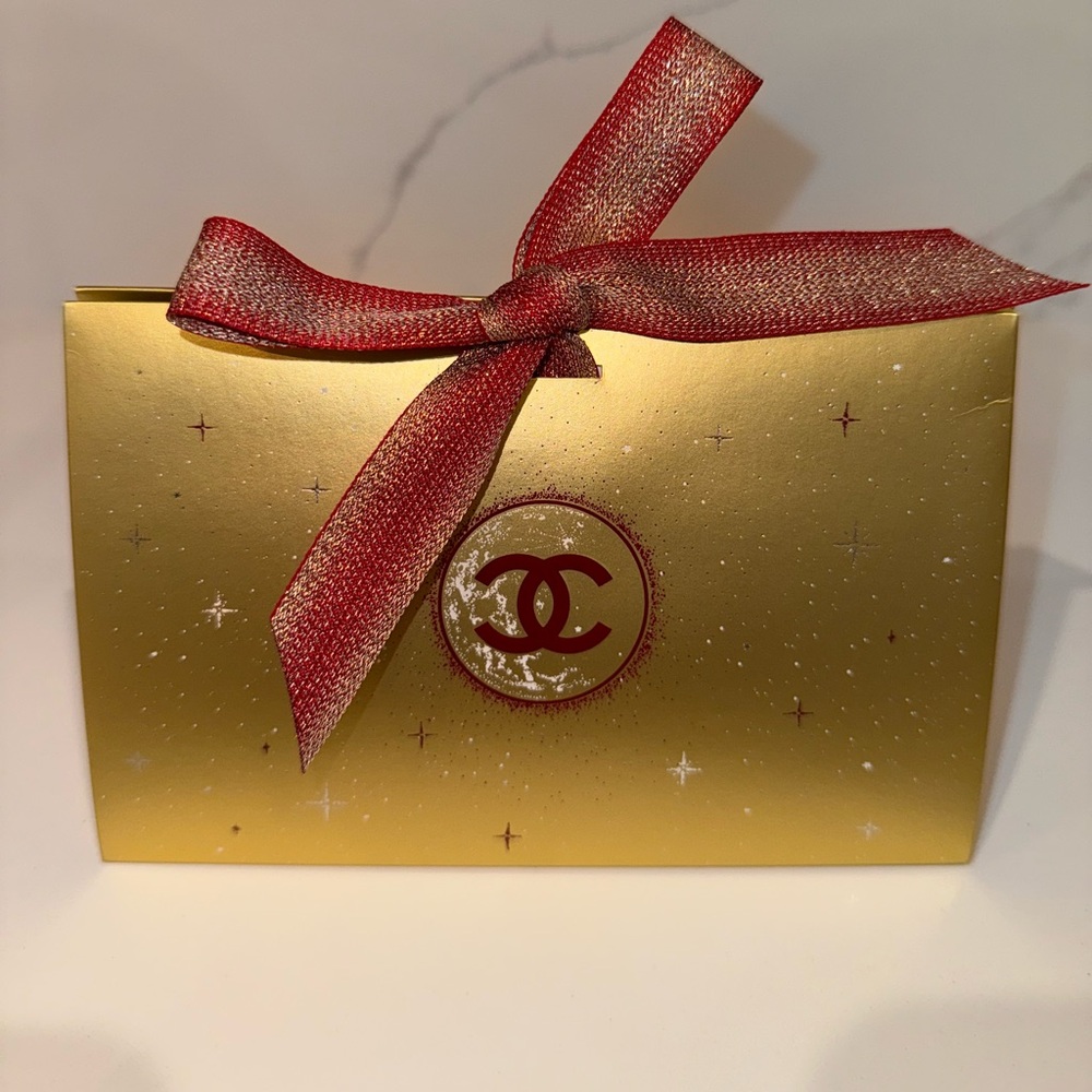 CHANEL Gold Box with Red Ribbon